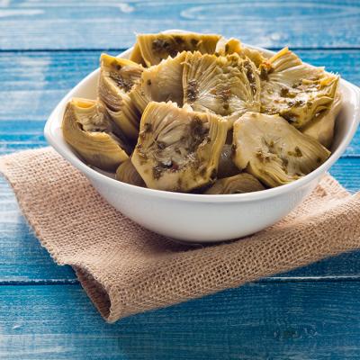 A bowl of grilled artichokes in oil.