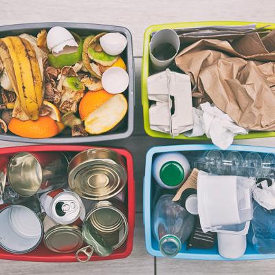 Four different container for sorting garbage for plastic, paper, metal and organic waste