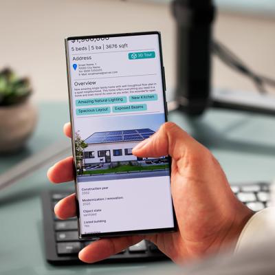 Person looking at the details of a house online.