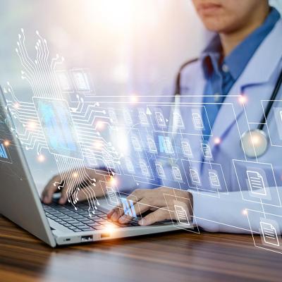 Concept of doctors using AI illustrated with medical professional with white coat and stethoscope using laptop computer with AI icons and symbols overlaid.