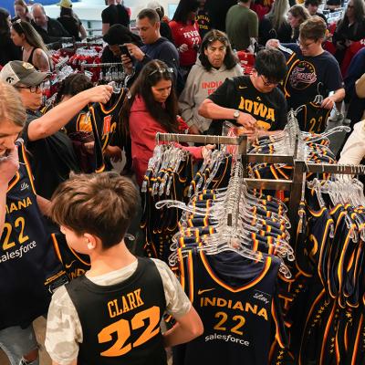 Fans looking at the merchandise in the team store before the game between the New York Liberty and the Indiana Fever at Gainbridge Fieldhouse, Indiana.