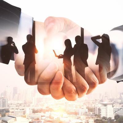 Illustration of businesspeople and a handshake.