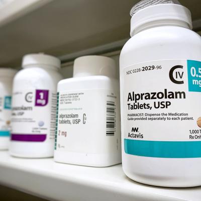 Bottles of Alprazolam bottle on a shelf.