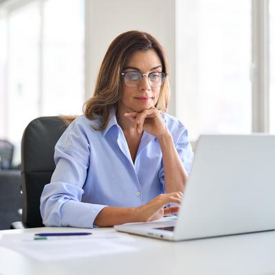 Middle-aged businesswoman in a corporate office.