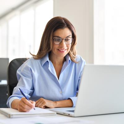 Middle-aged businesswoman working in a corporate office.