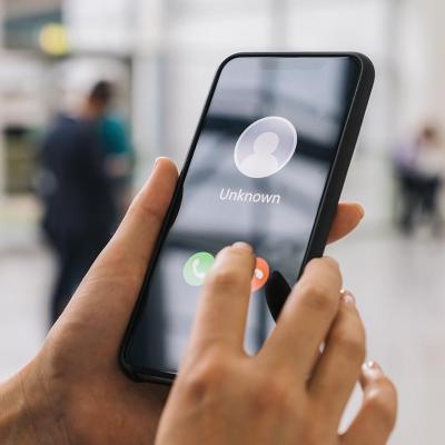 Person holding a cell phone.