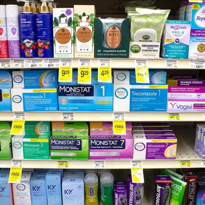 A view of several shelves dedicated to yeast infection products in a drugstore.