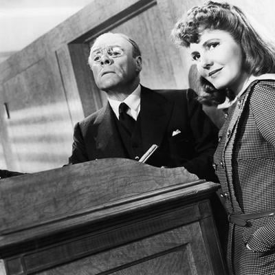 Black and white image of Spring Byington, unidentified man, and Jean Arthur in a scene from the film 'The Devil And Miss Jones', 1941. 