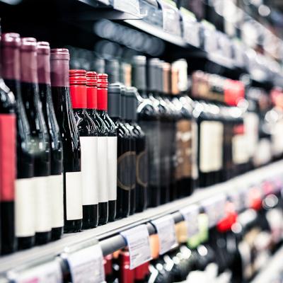 Bottles of wine on a shelf in a liquor store.