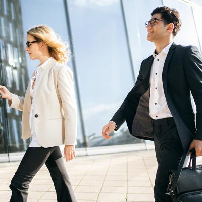 Two business professionals on the way to their work.