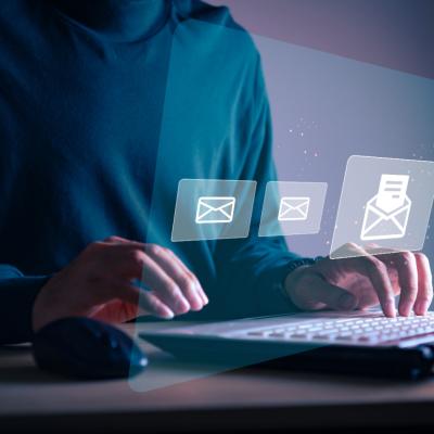 Businessman sending email to customer.