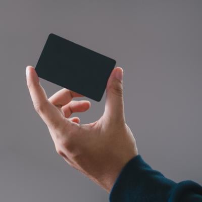 Hand holding a credit card.