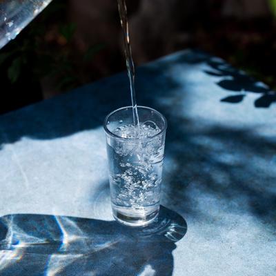 Water being poured onto a glass.