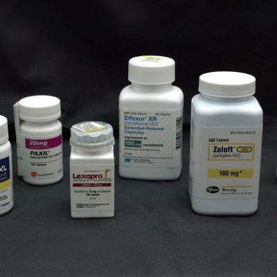Bottles of antidepressant pills. From left to right: Wellbutrin, Paxil, Lexapro, Effexor, Zoloft, and Fluoxetine.