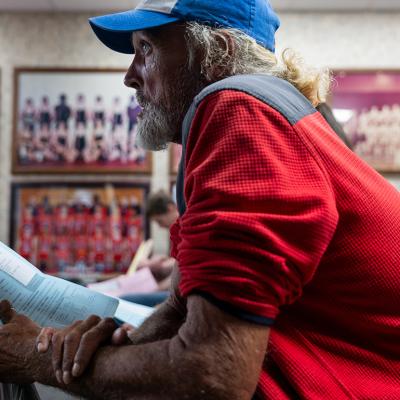James Wolcott, a patient waits to take a vision test for a new pair of glasses at a Remote Area Medical (RAM) mobile dental and medical clinic at Terre Haute South High School, Indiana.
