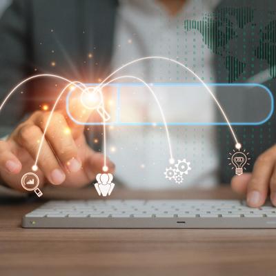Person using a keyboard illustrated with data search technology graphics.