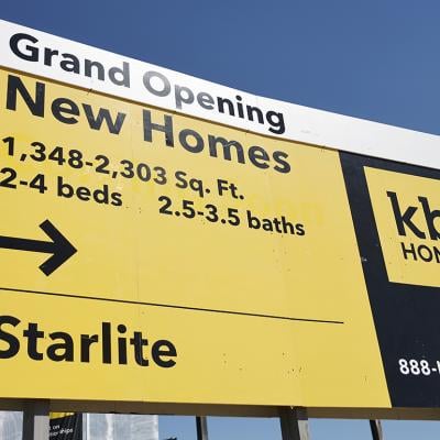 A "Grand Opening" of new homes signage is displayed at a new KB Home community in South El Monte, California.