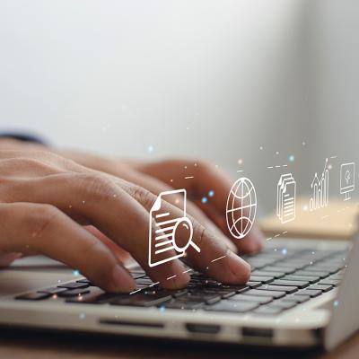 Content marketing graphics over hands typing on a laptop keyboard.