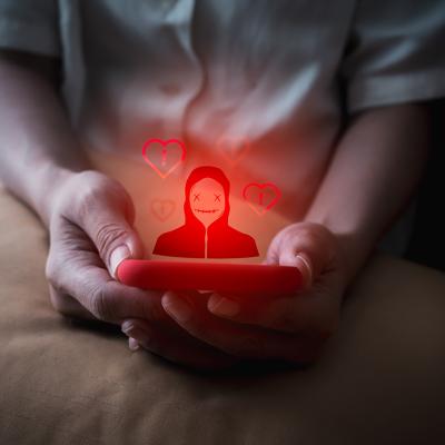 A person using a smartphone illustrated with a red anonymous identity graphics.