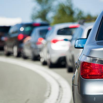One side of the road with bumper-to-bumper traffic.