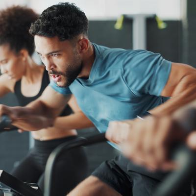 People during a fitness bike gym session.
