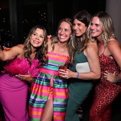 Marisa Peters (2nd L) poses for a selfie with guests at the BE SEEN Gala on June 7, 2025 at Harriet's Rooftop in Los Angeles, California.