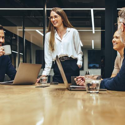 A happy business team having a meeting in a boardroom.