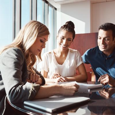 A couple engaging in a discussion with a financial advisor.