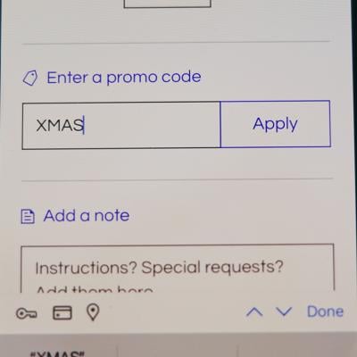A Christmas promo code added into a shopping app checkout page.
