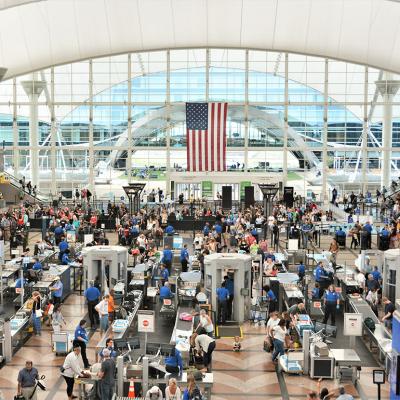 Travelers form long lines at the TSA screening areas of Denver International Airport.