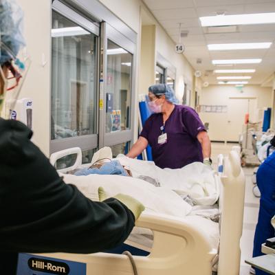 Emergency Room nurses fill a hallway as they tend to patients at the Houston Methodist The Woodlands Hospital in Texas.