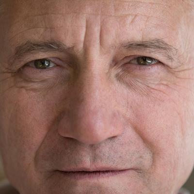 A close up photograph of a white elderly man.
