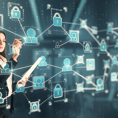 A businesswoman interacting with a 3D holographic network of people concept technology.