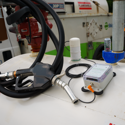 A fuel monitor device and a pump on top of a gas tank.