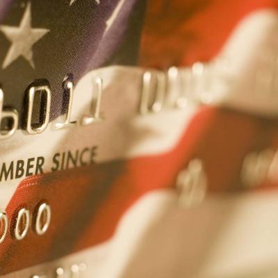 A close up of a credit card designed with the US flag.