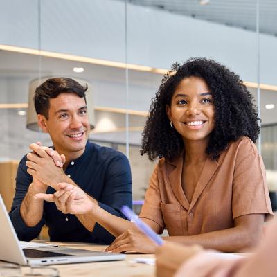 Professional employees discussing a project in their office.