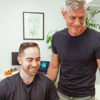 Startup professionals checking on a project in an office.