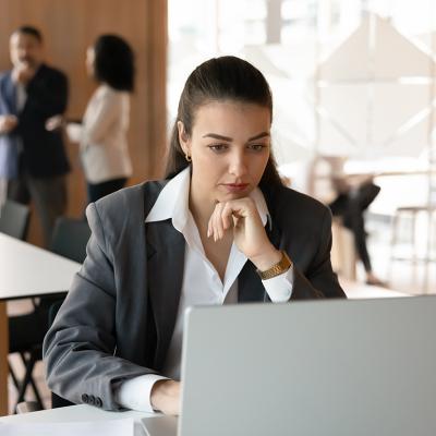 A young female professional working in a corporate office.