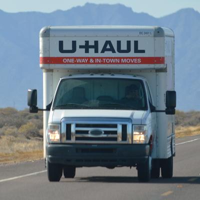 A U-Haul truck on a highway.