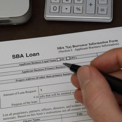 An SBA loan application form being filled out.