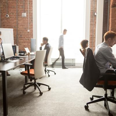 A busy team of employees around a modern office.