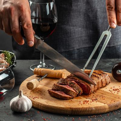 Grilled steak on a wooden cutting board and a glass of red wine.