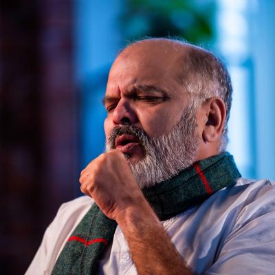 A senior man coughing.