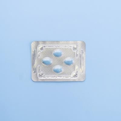 A blister package of Sildenafil, also known as Viagra, on a blue background.