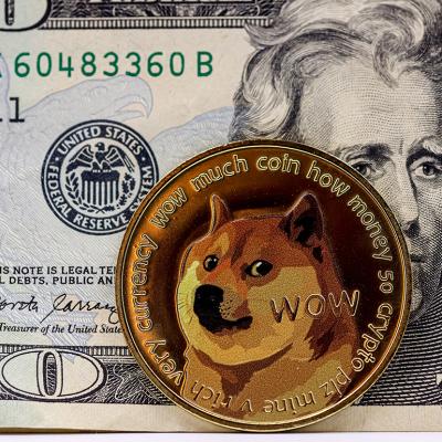Crypto Dogecoin in front of a $20 US banknote.