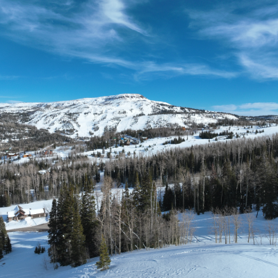 An aerial view of Brian Head ski resort in winter on a clear day.