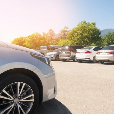 Parking lot with cars parked.