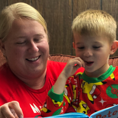 Jeana Wallace reading a book to her son, Levi, during bedtime.