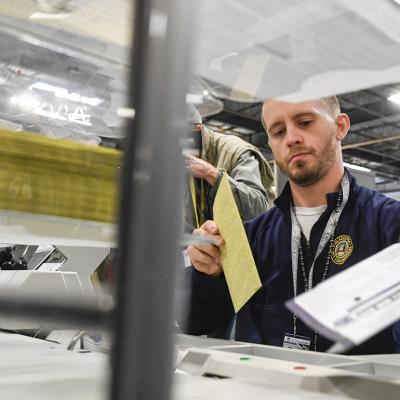 Poll workers demonstrate how ballots are received, processed, scanned, and securely stored on Election Day.