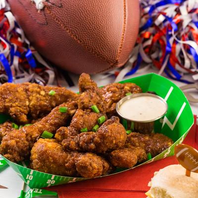 A plate of buffalo chicken wings for a football game day.